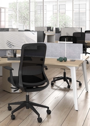 Office with wood floor, ergonomic black chair and white desk with hardwood finish.